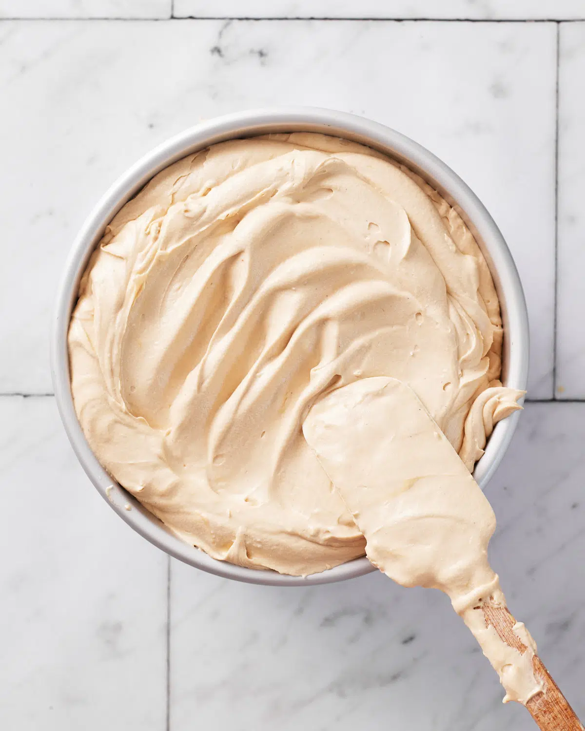 cheesecake batter in pan for biscoff cheesecake.