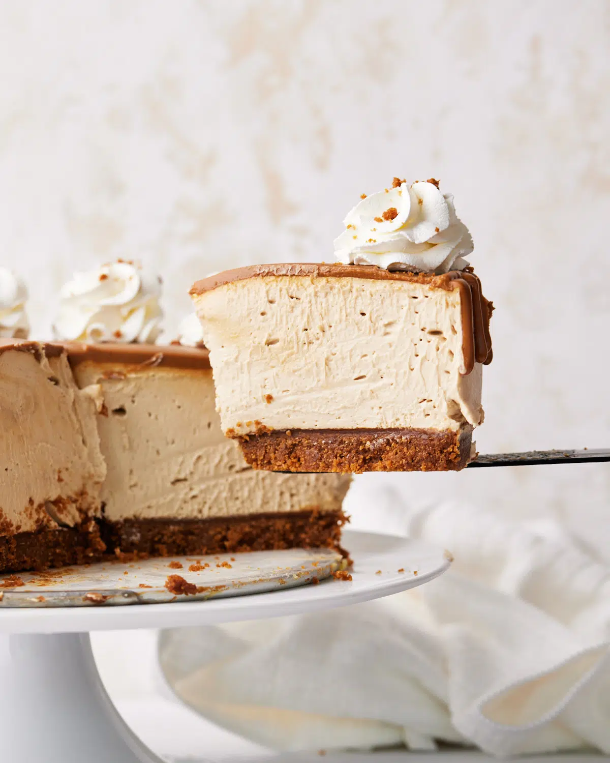 slice of biscoff cheesecake being taken.