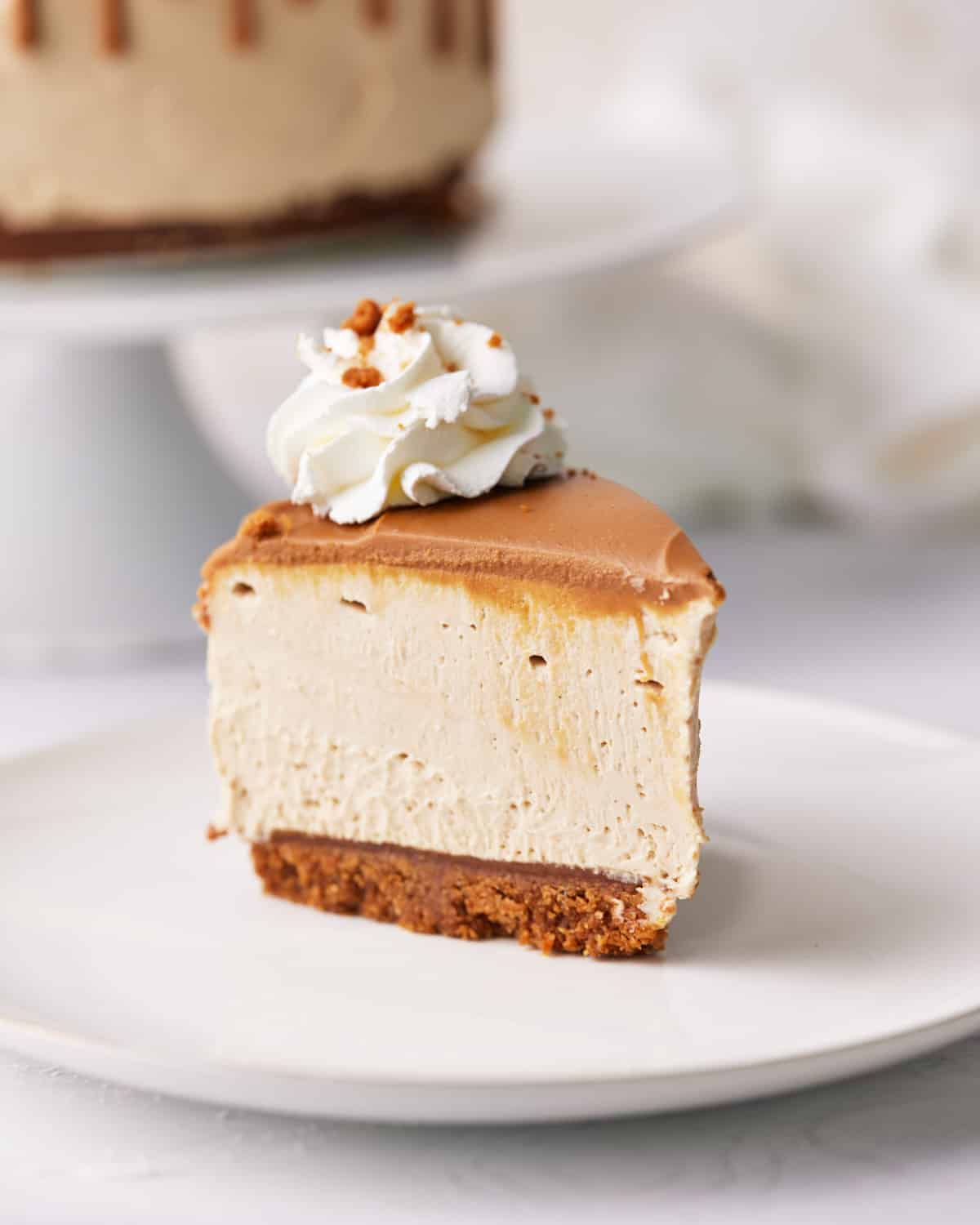 slice of biscoff cookie butter cheesecake on a plate.