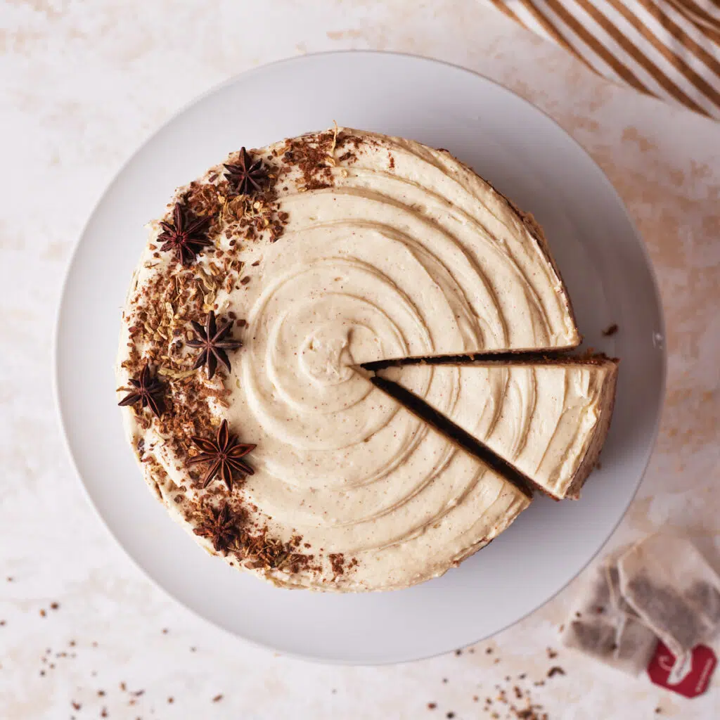 chai cake from above with a slice being taken out.