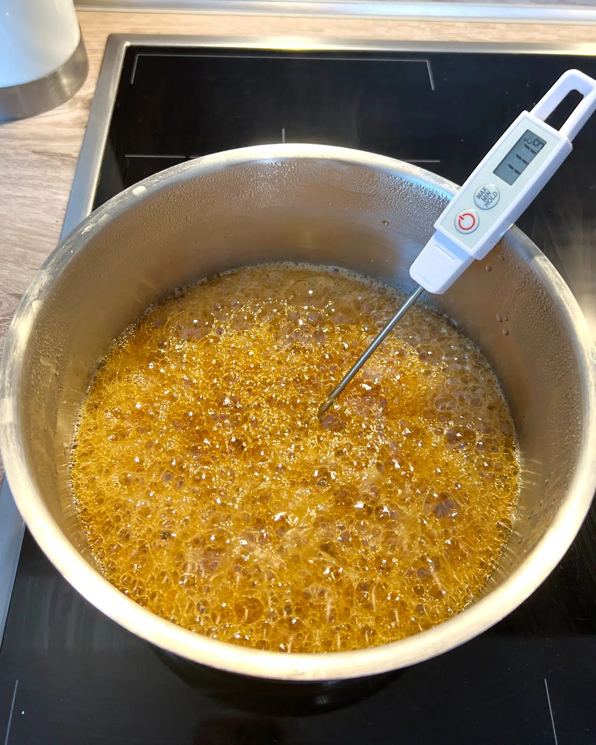 boiling maple syrup to make maple cream.