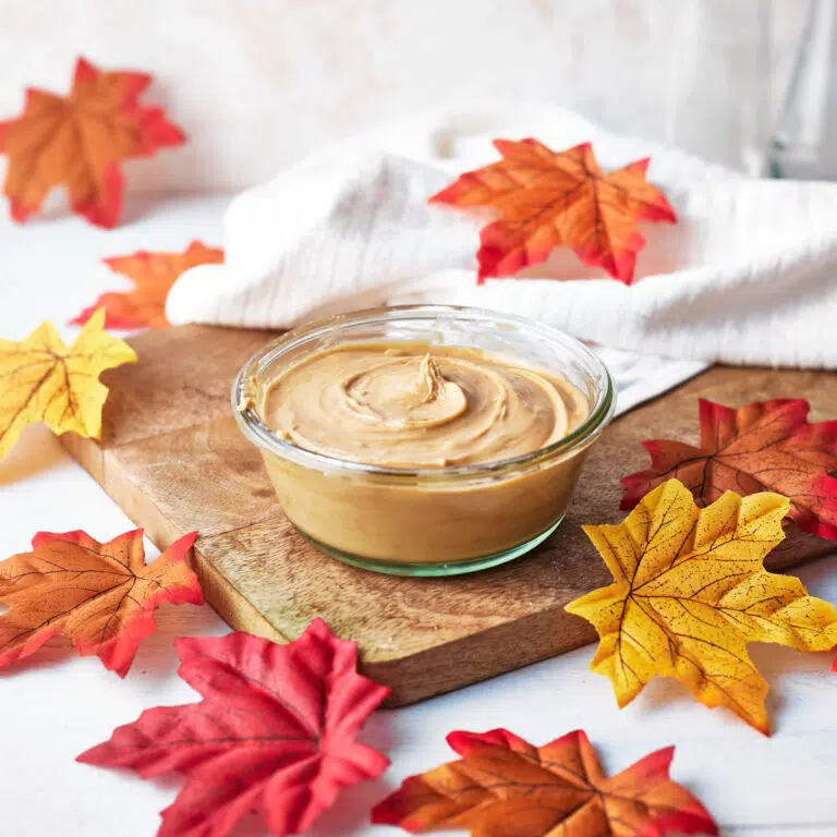 homemade maple cream in a glass jar.