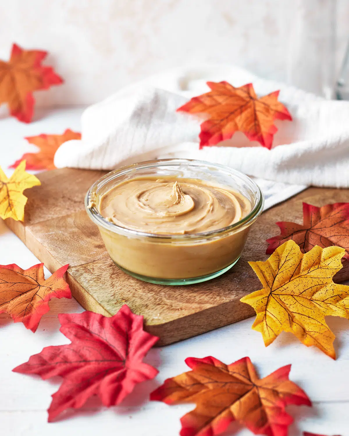 homemade maple cream in a glass jar.