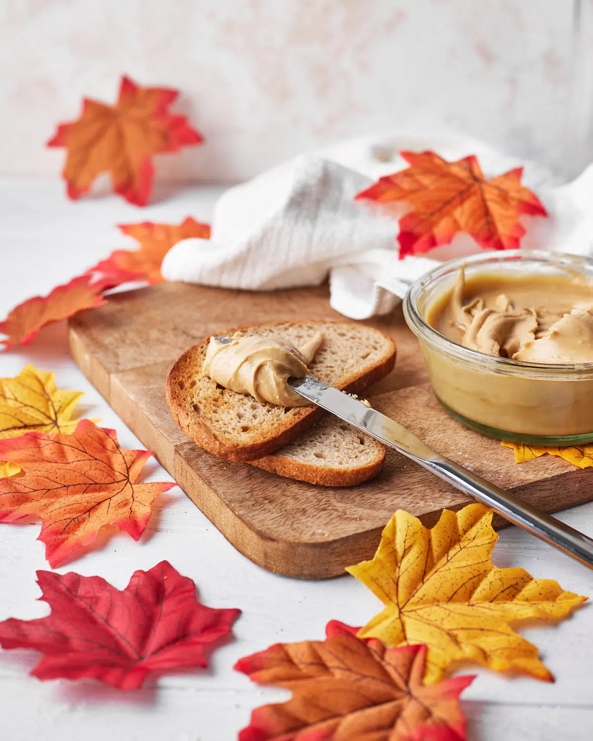 maple cream being spread on toast.