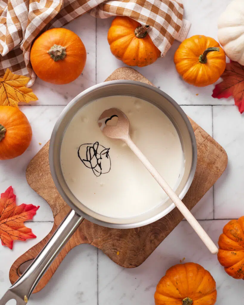 heavy cream and vanilla in saucepan for pumpkin creme brulee.