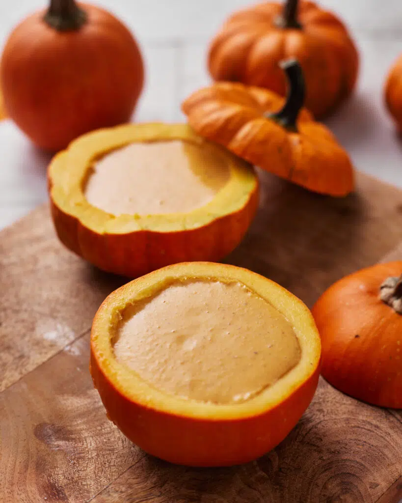 pumpkin creme brulee in a pumpkin, ready to be baked.