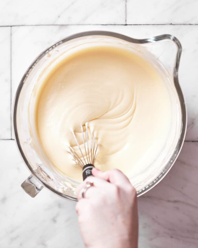 whisking cheesecake mixture for san sebastian cheesecake.