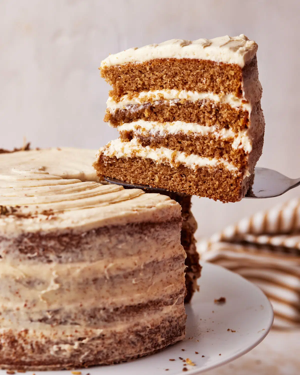 chai cake with single slice being lifted out of it.