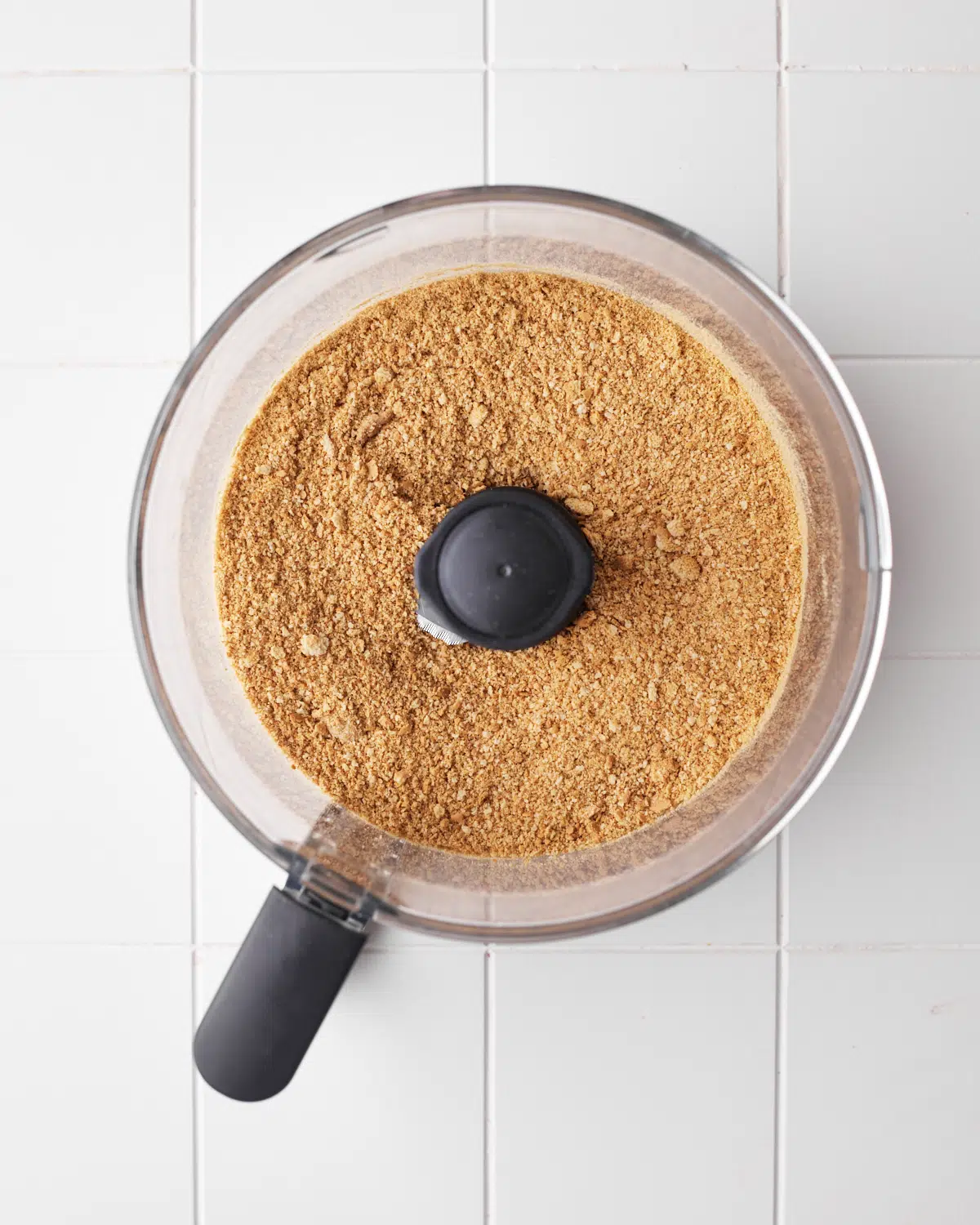 graham cracker crumbs in a food processor for cheesecake crust.