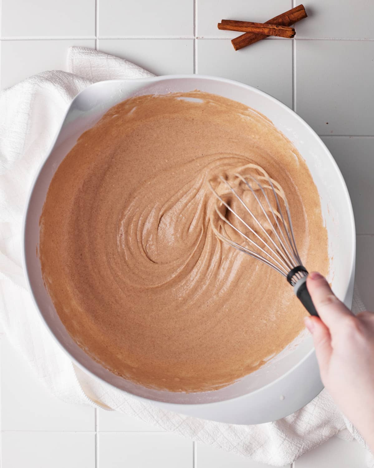 cinnamon waffle batter being whisked. 