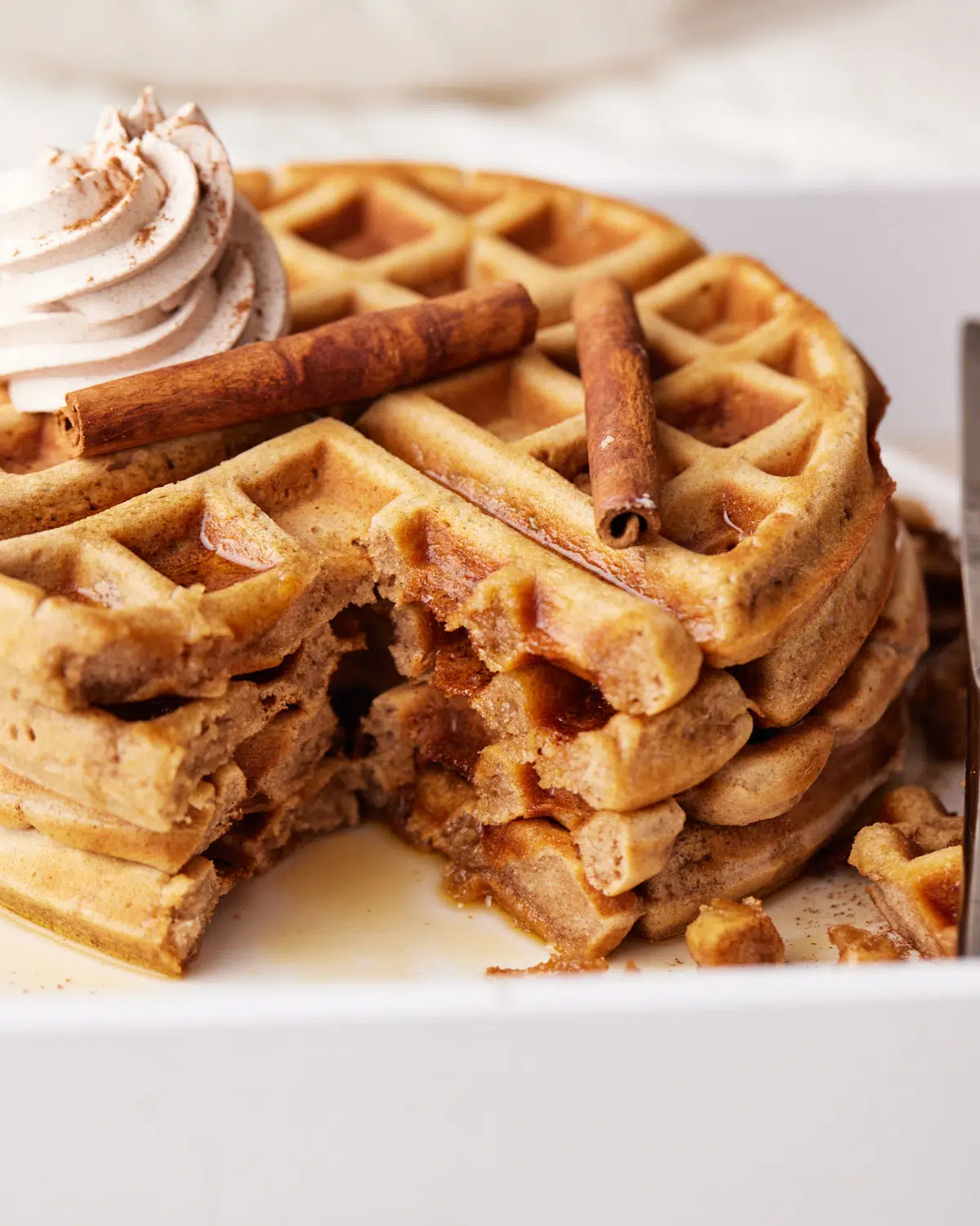 cinnamon waffles with a section cut out.
