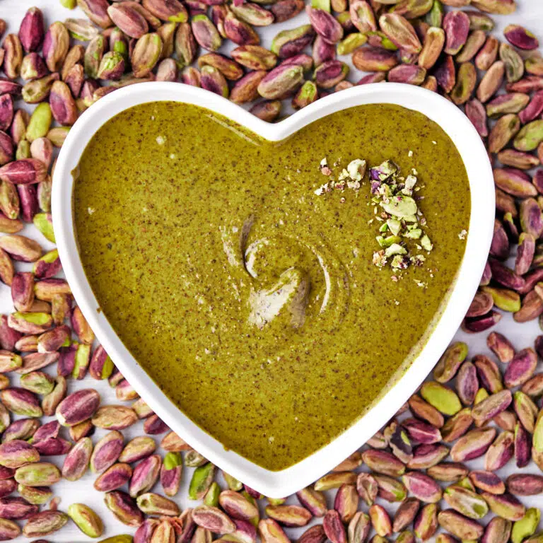 homemade pistachio butter in a heart shaped bowl.