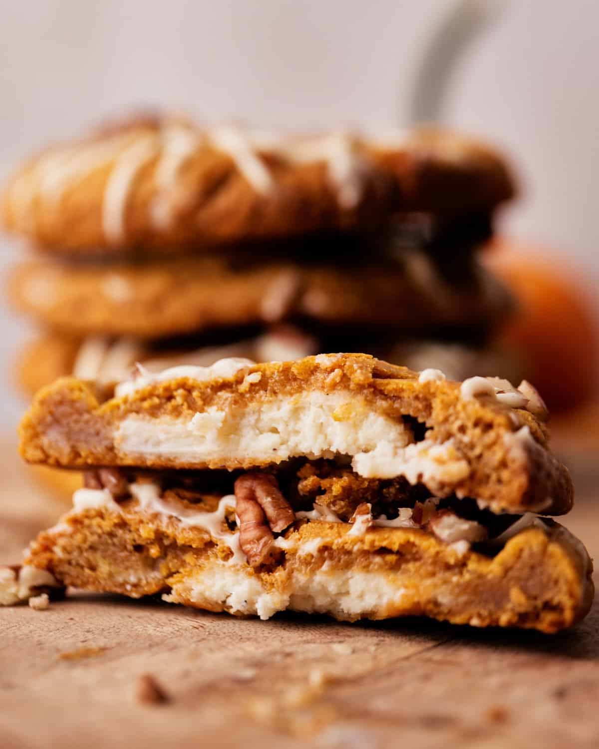 pumpkin cheesecake cookies with cream cheese filling showing