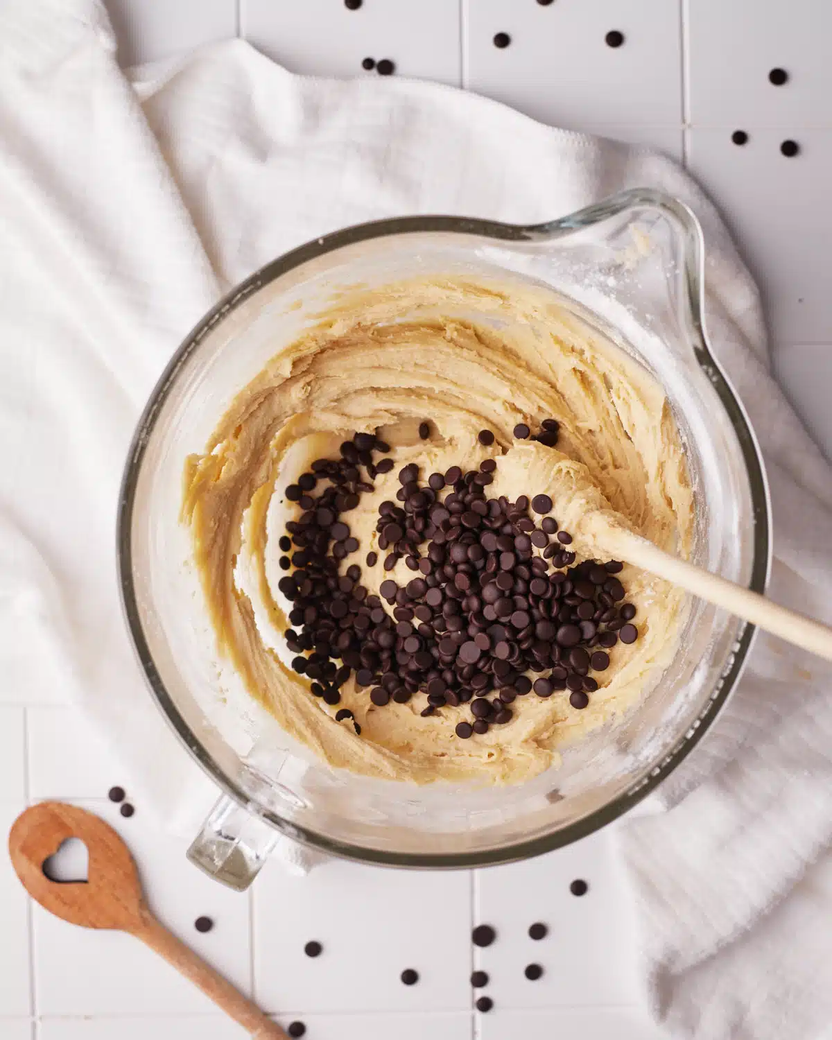 chocolate chips going into edible cookie dough.