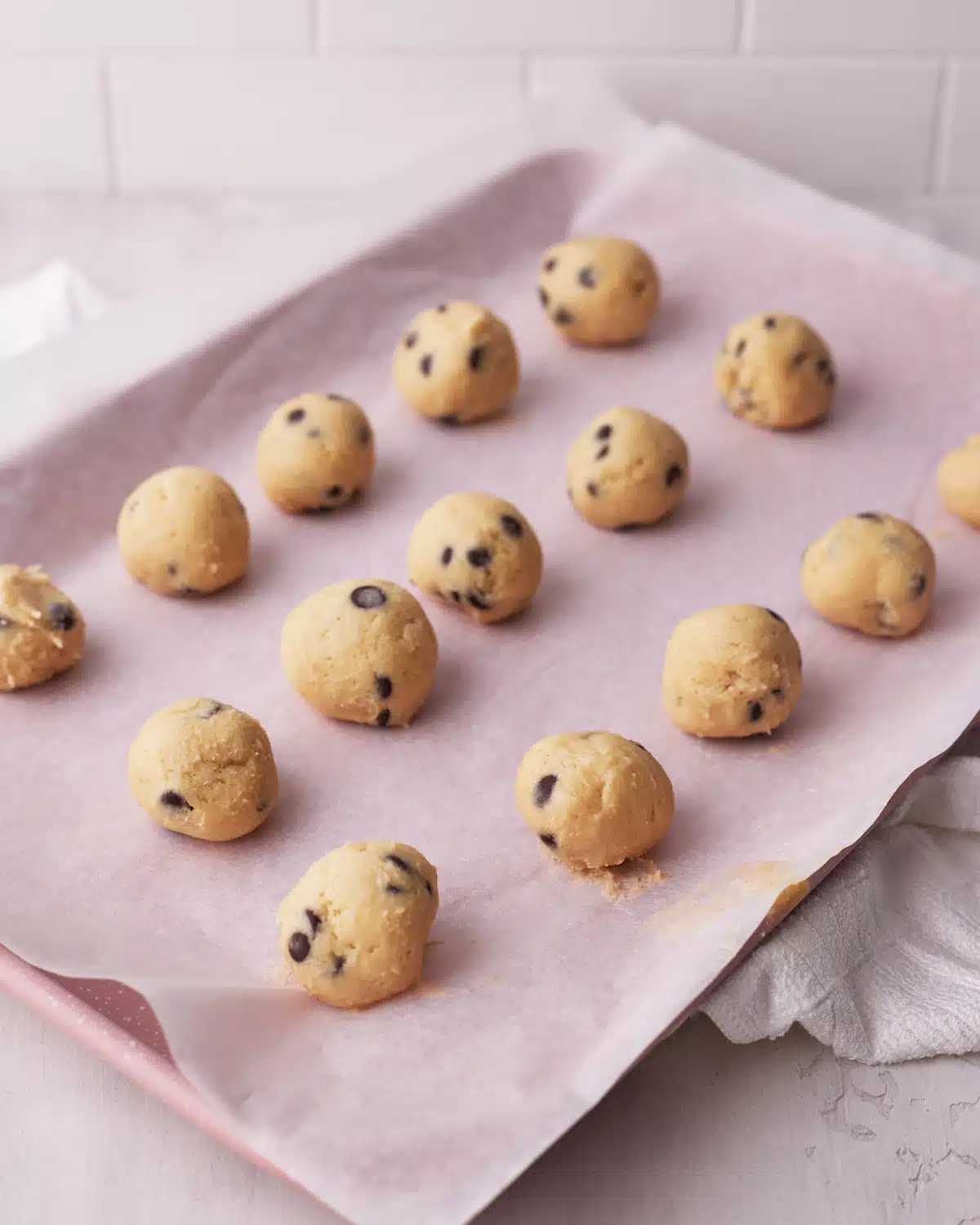 no bake cookie dough bites on a baking sheet.