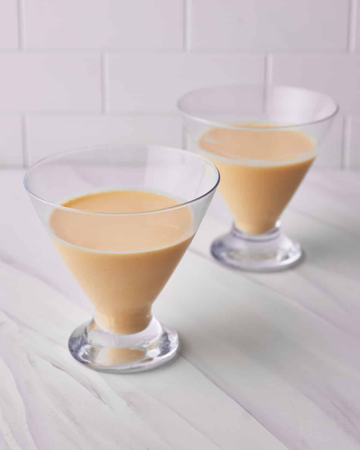 creme anglaise in a glass dish for floating island desserts.
