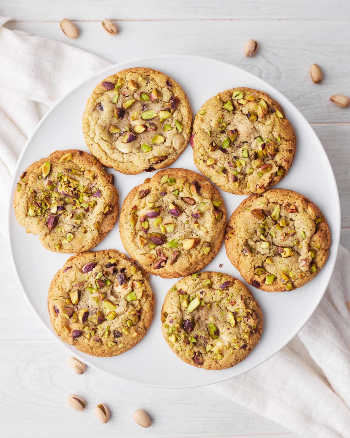pistachio cookies from above, lying flat on a plate.