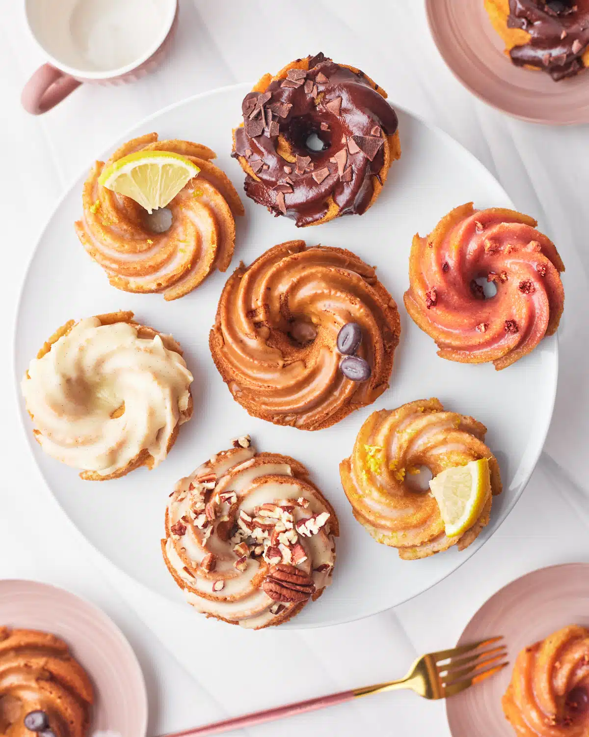 Mini bundt cakes on a plate - six different flavors from one base recipe. 