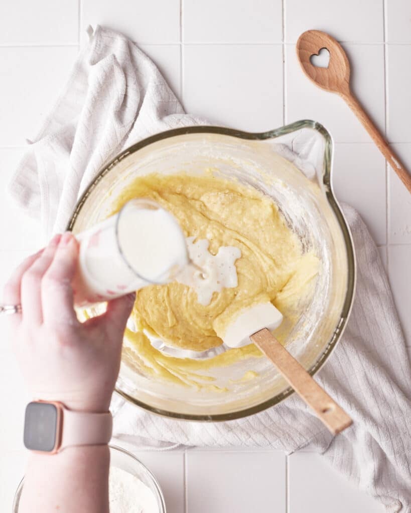 process shot mixing milk into mini bundt cake batter.