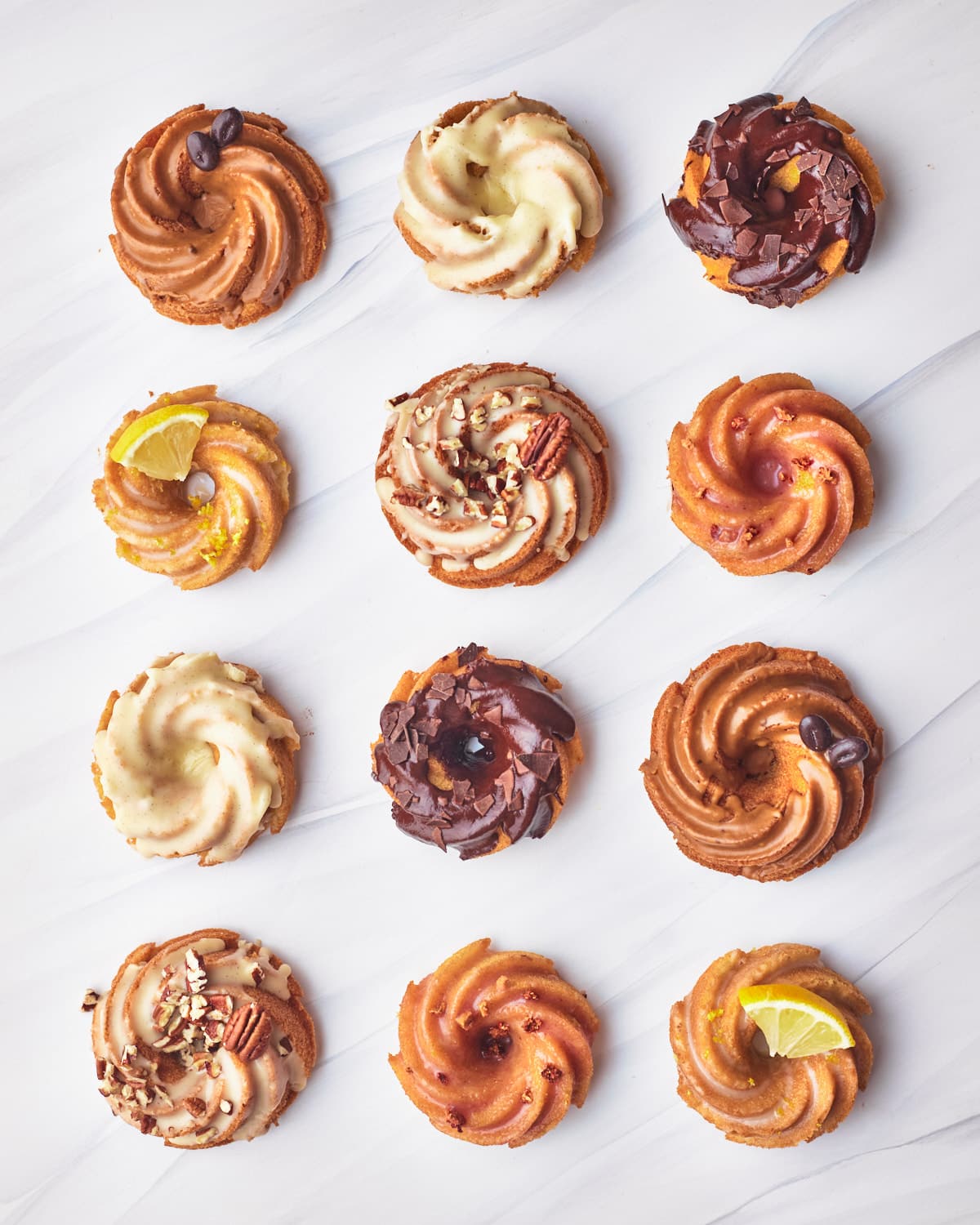various flavors of mini bundt cakes shot from above.