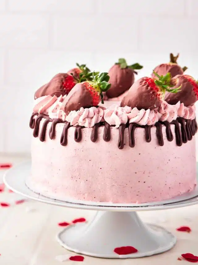 chocolate strawberry cake with chocolate drip and chocolate covered strawberries.