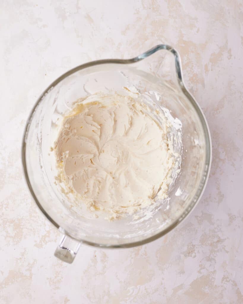process shot of making mascarpone cream for tiramisu cookies.