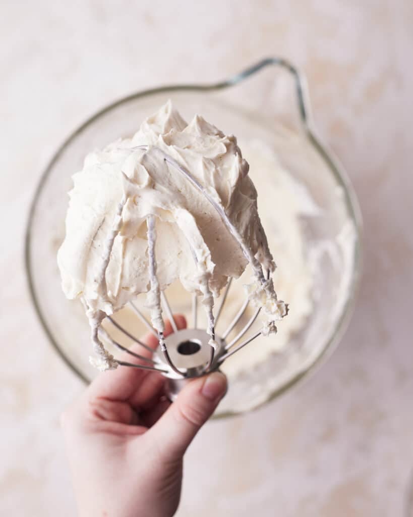 process shot of making mascarpone cream for tiramisu cookies.