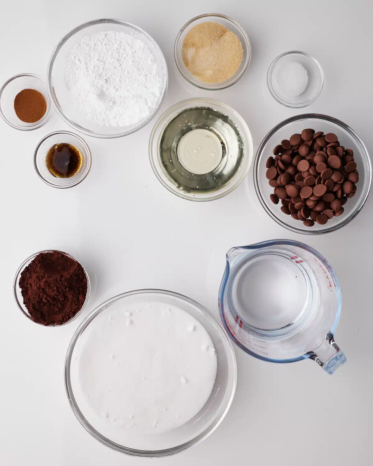 Ingredients to make chocolate marshmallow - sugar, corn syrup, cocoa powder, gelatine powder, water, espresso powder, powdered sugar and chocolate. 