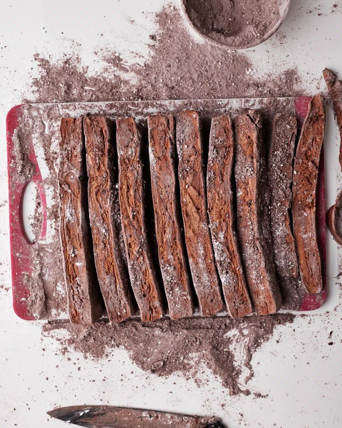 Cutting up chocolate marshmallow into strips. 