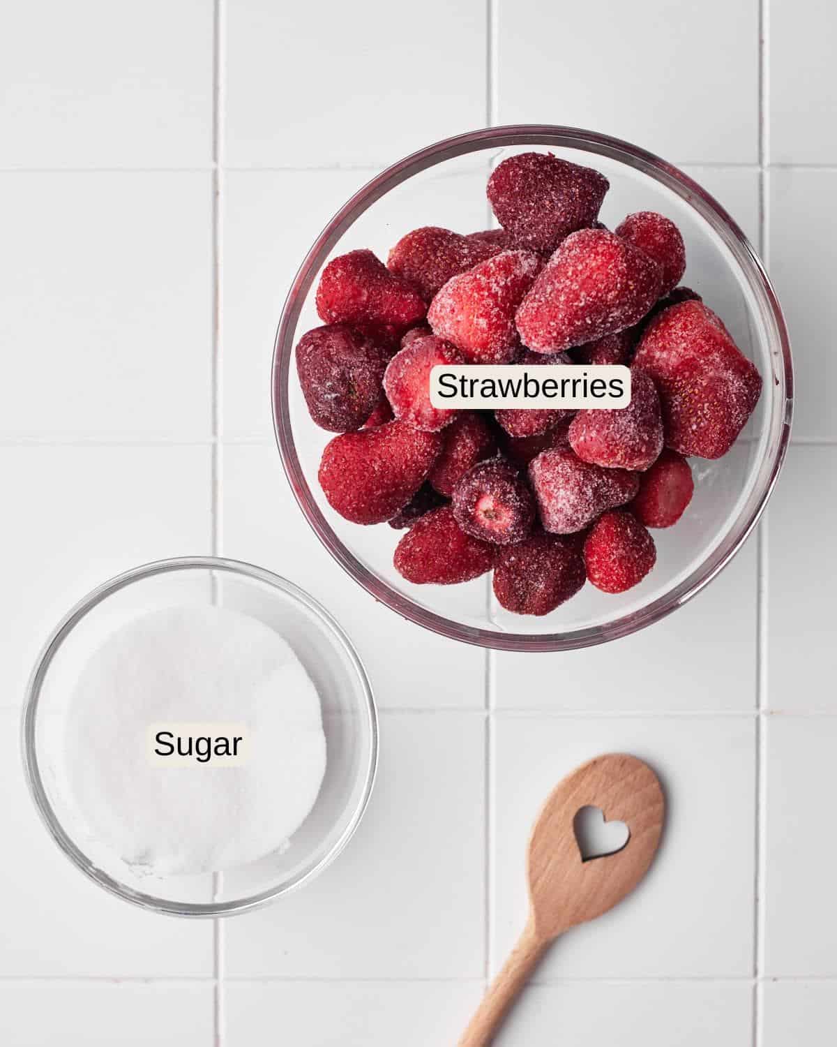 Labelled ingredients for strawberry puree, including strawberries and sugar.