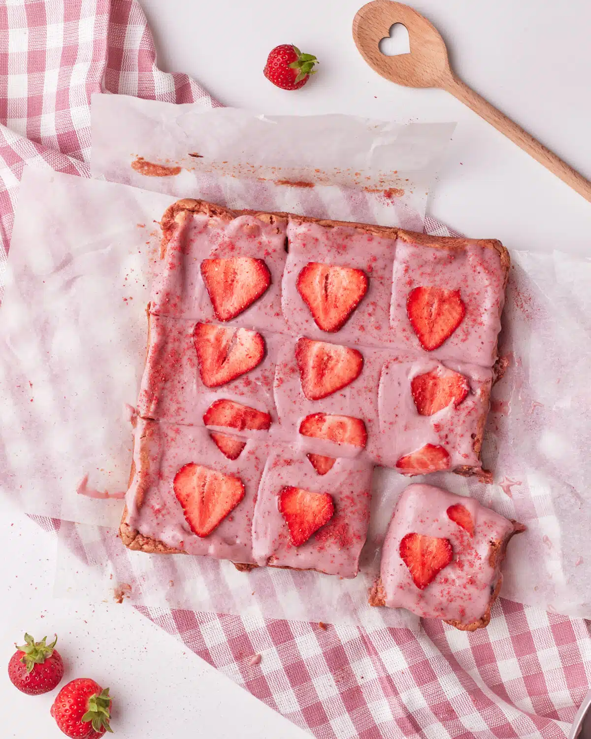 strawberry brownies sliced into equal squares.