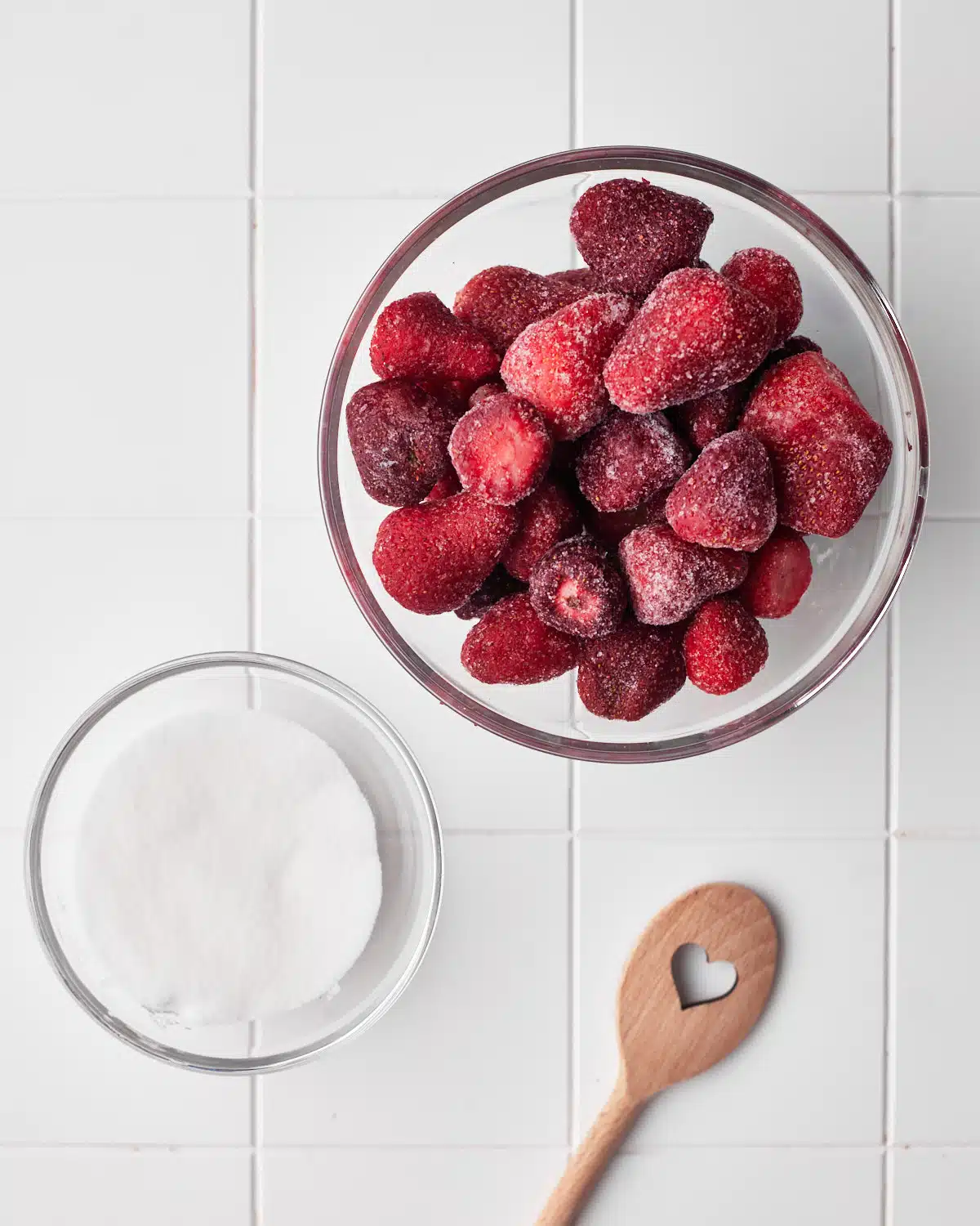 ingredients to make strawberry puree or strawberry coulis - frozen strawberries and sugar. 