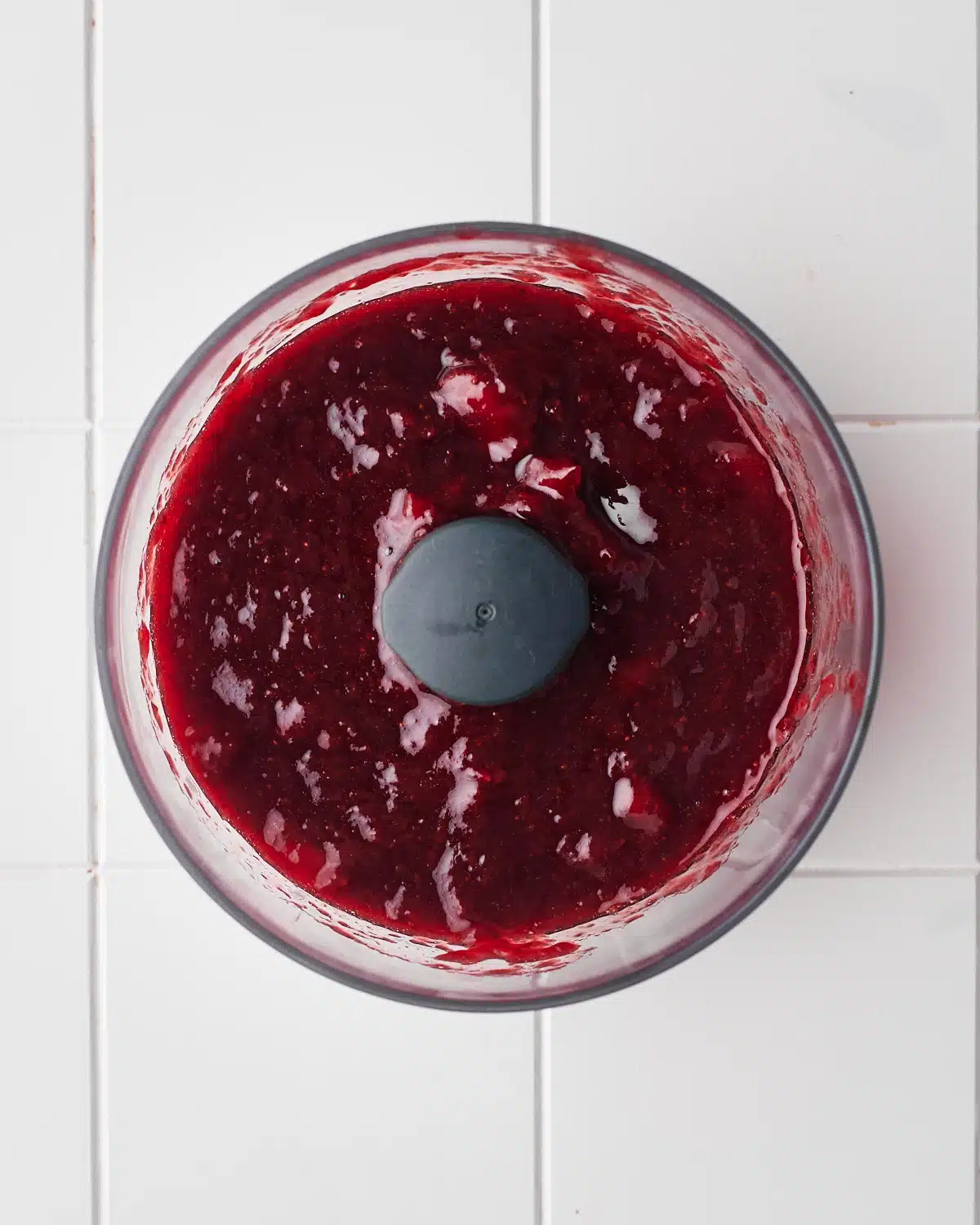 strawberry puree in a food processor before blending.