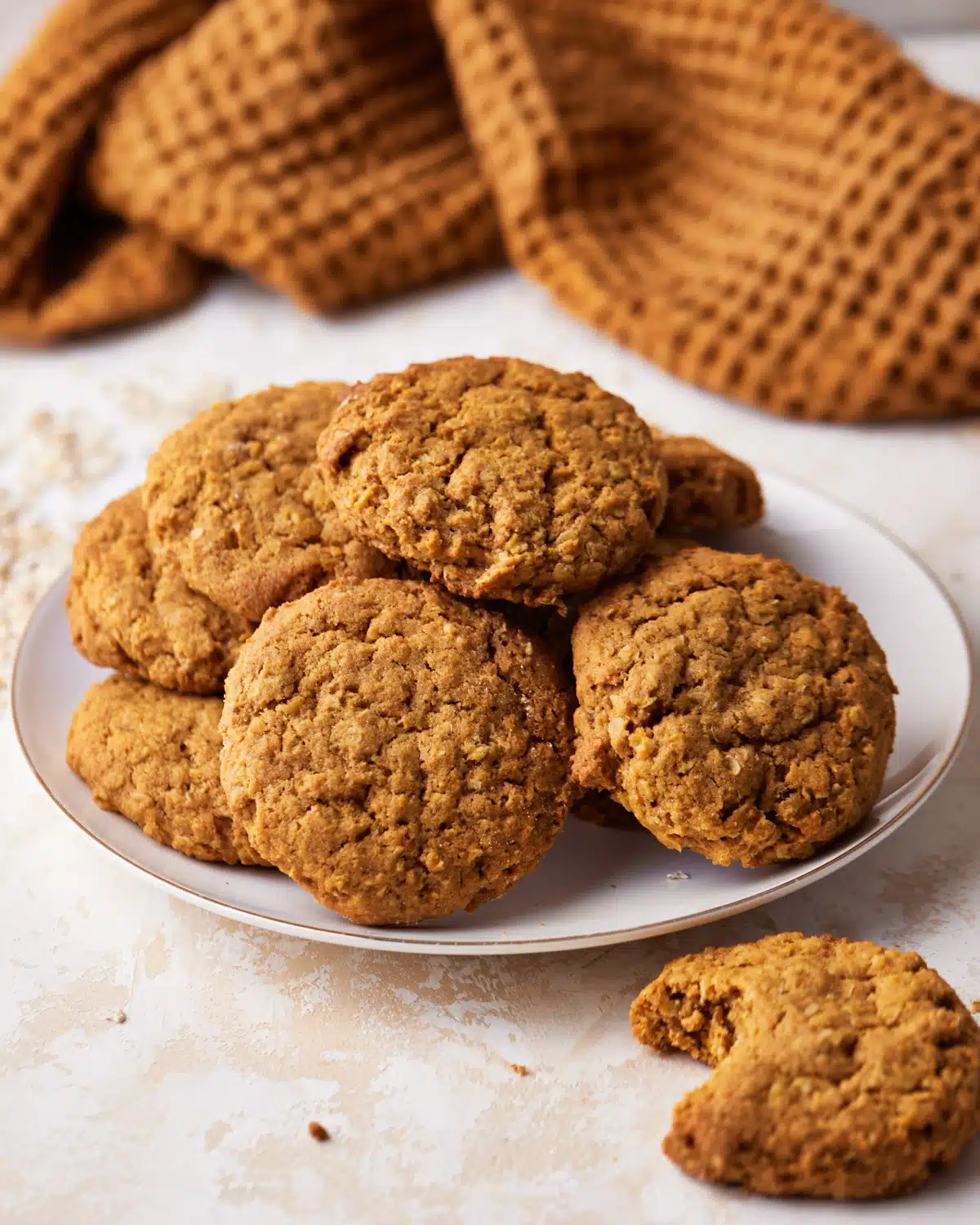 Plate piled high with pumpkin oatmeal cookies. 