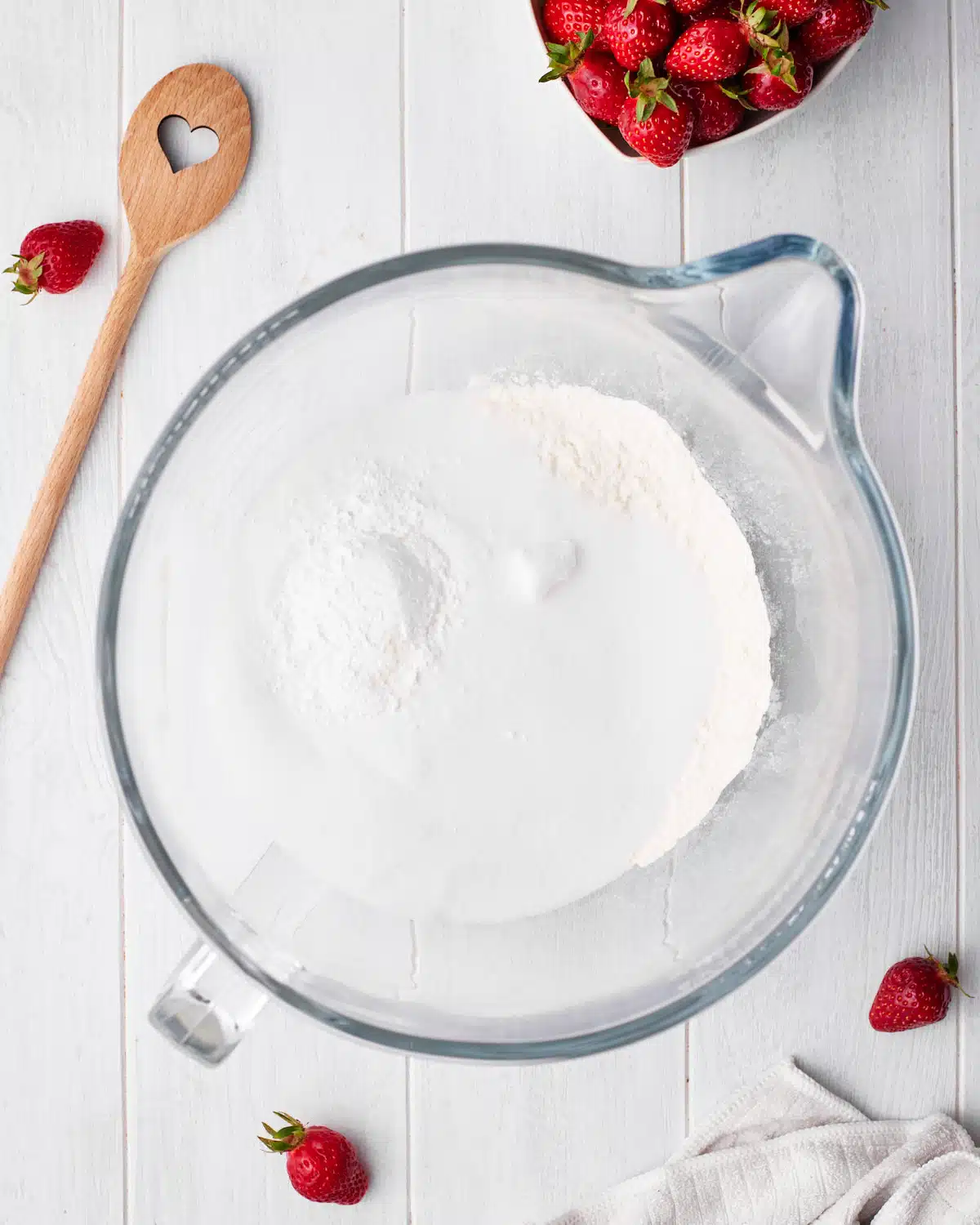 process shot of dry ingredients to make strawberry cupcakes. 