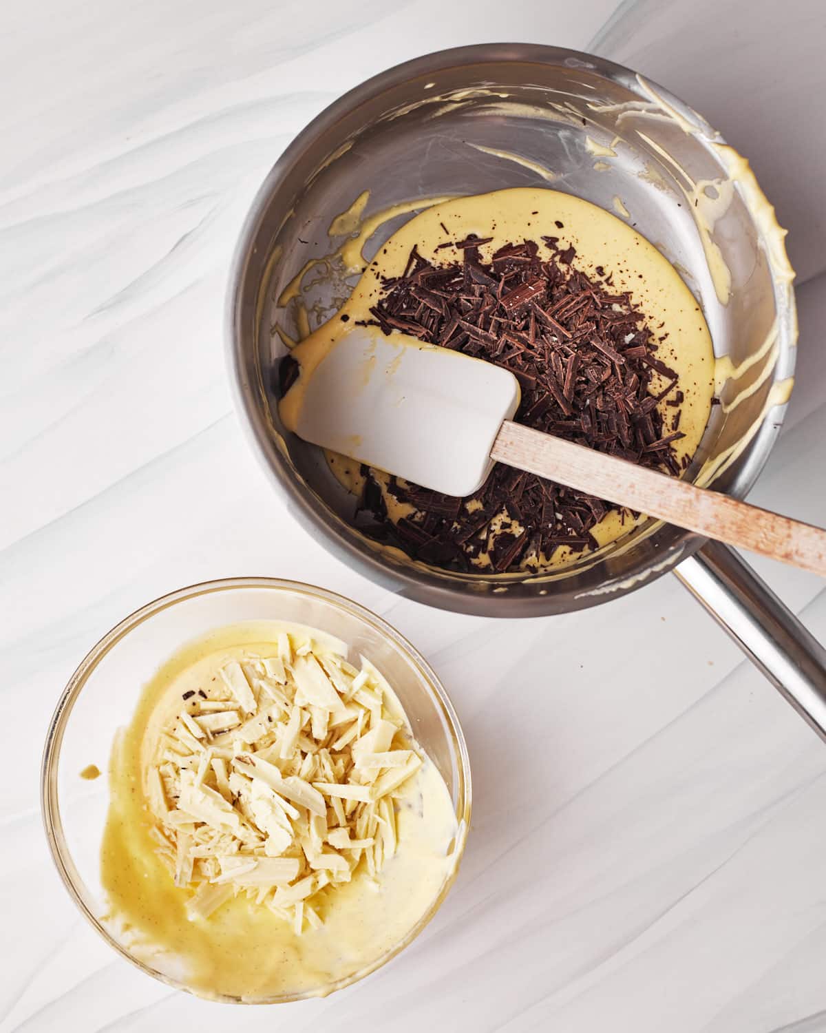 mixing chocolate mousse mixture with dark and white chocolate in order to make tuxedo cake. 