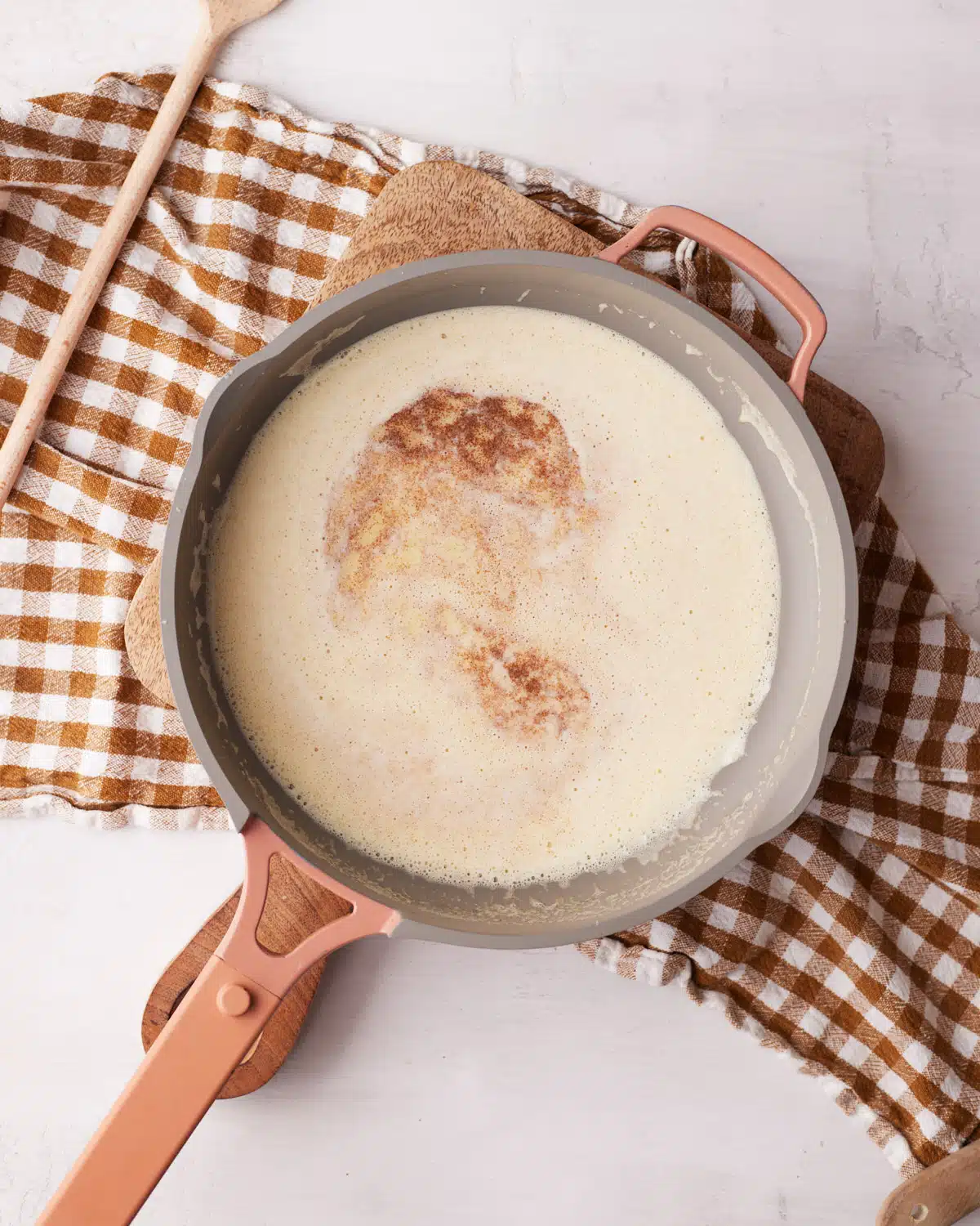 Brown butter in a pan at the foaming stage.