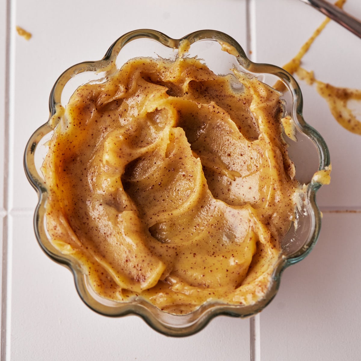 solidified brown butter in a small glass dish.