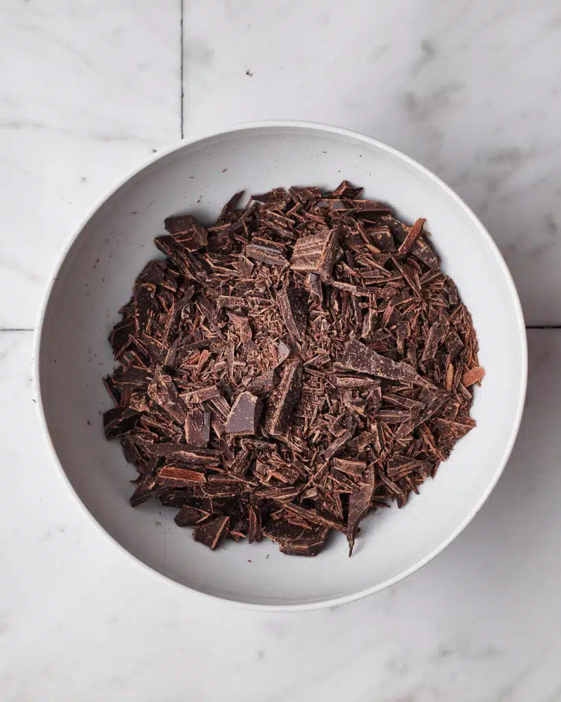 Chopped chocolate in a bowl to make chocolate ganache.