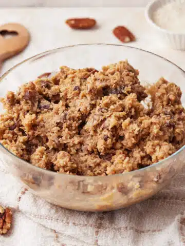 German chocolate frosting in a glass bowl.