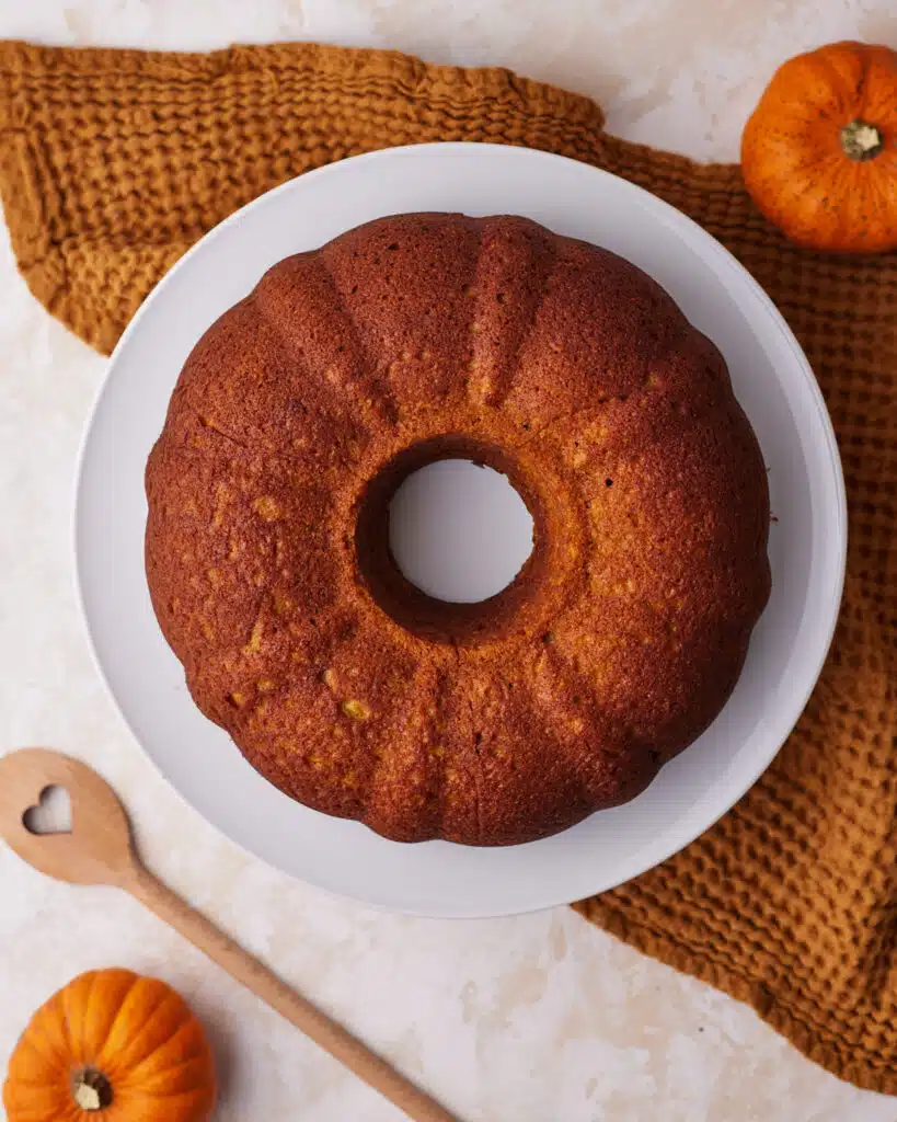 Baked pumpkin bundt cake ready to be glazed.