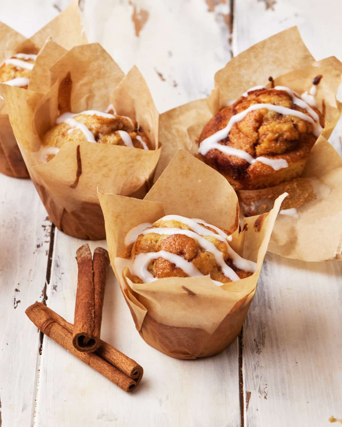 Cinnamon roll muffins with cream cheese glaze.