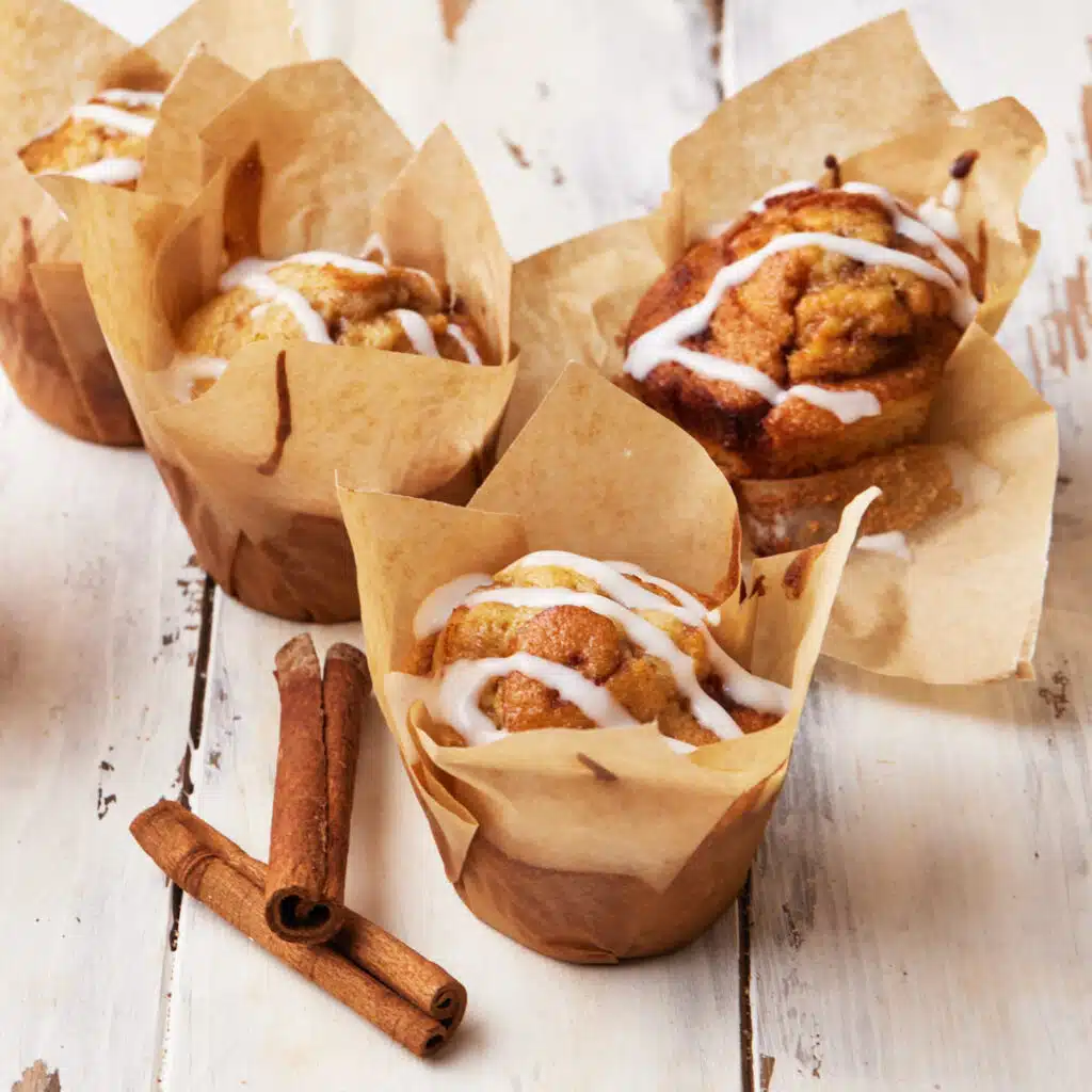 Cinnamon roll muffins with cream cheese glaze.