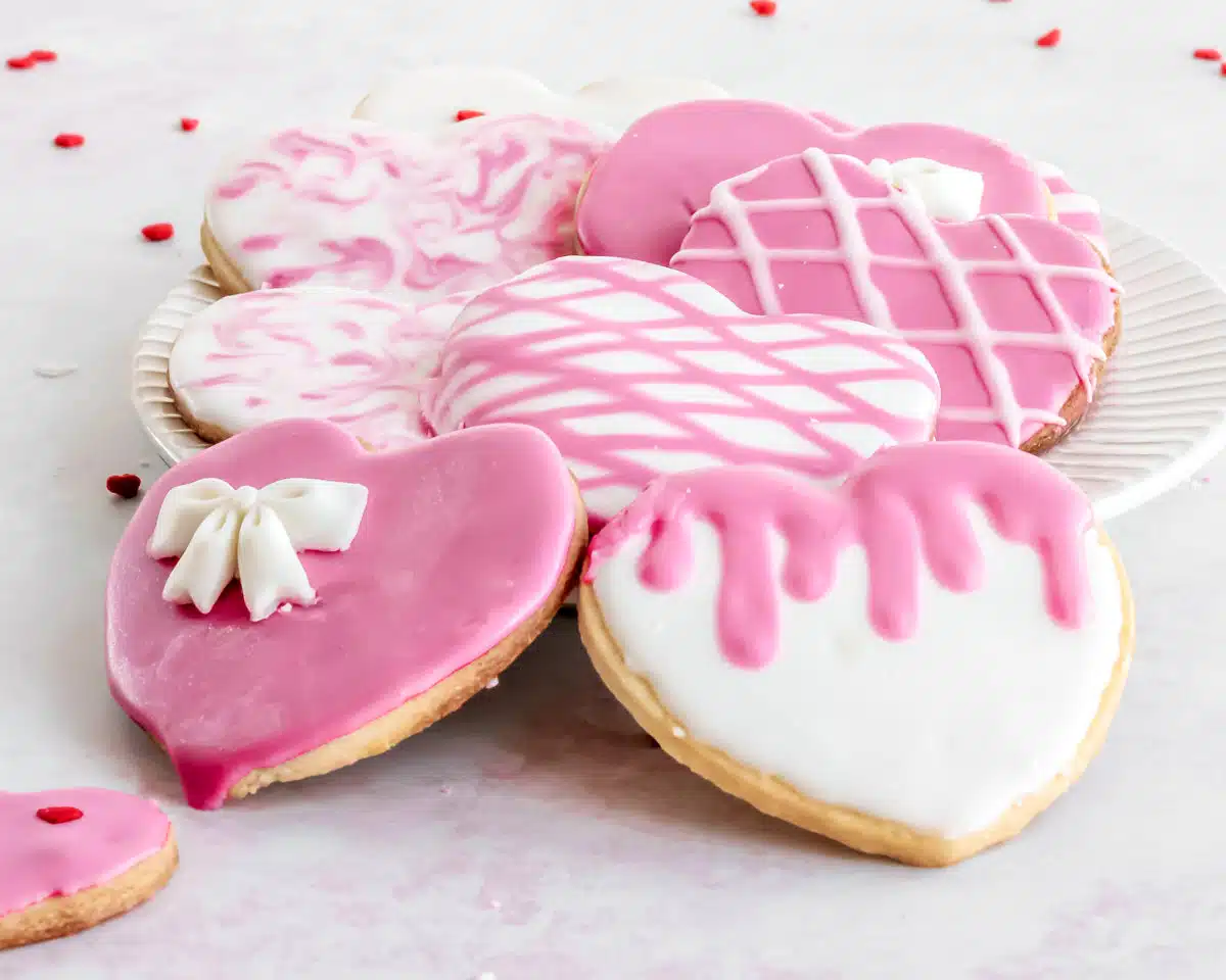 Heart cookies decorated in pink and white for valentine's day.