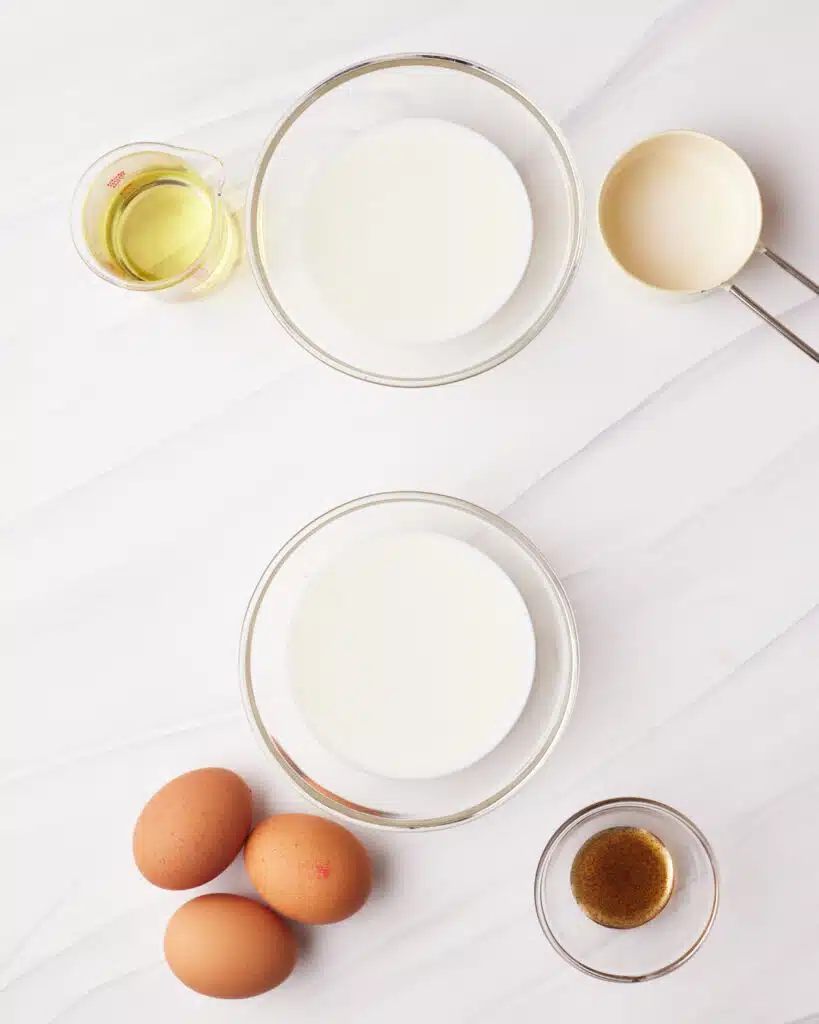 Process shot of making vanilla cupcakes - separating milk into two portions.