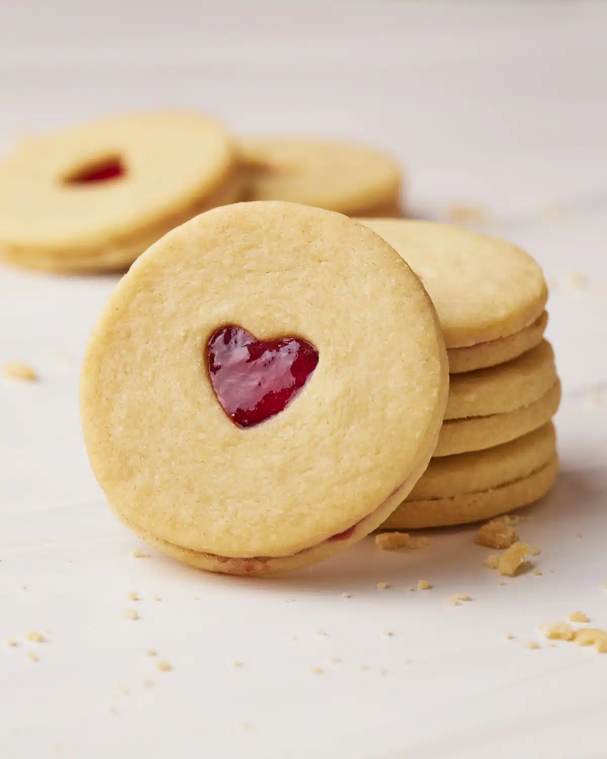 Stack of homemade jammie dodgers with one leaning on the side. 