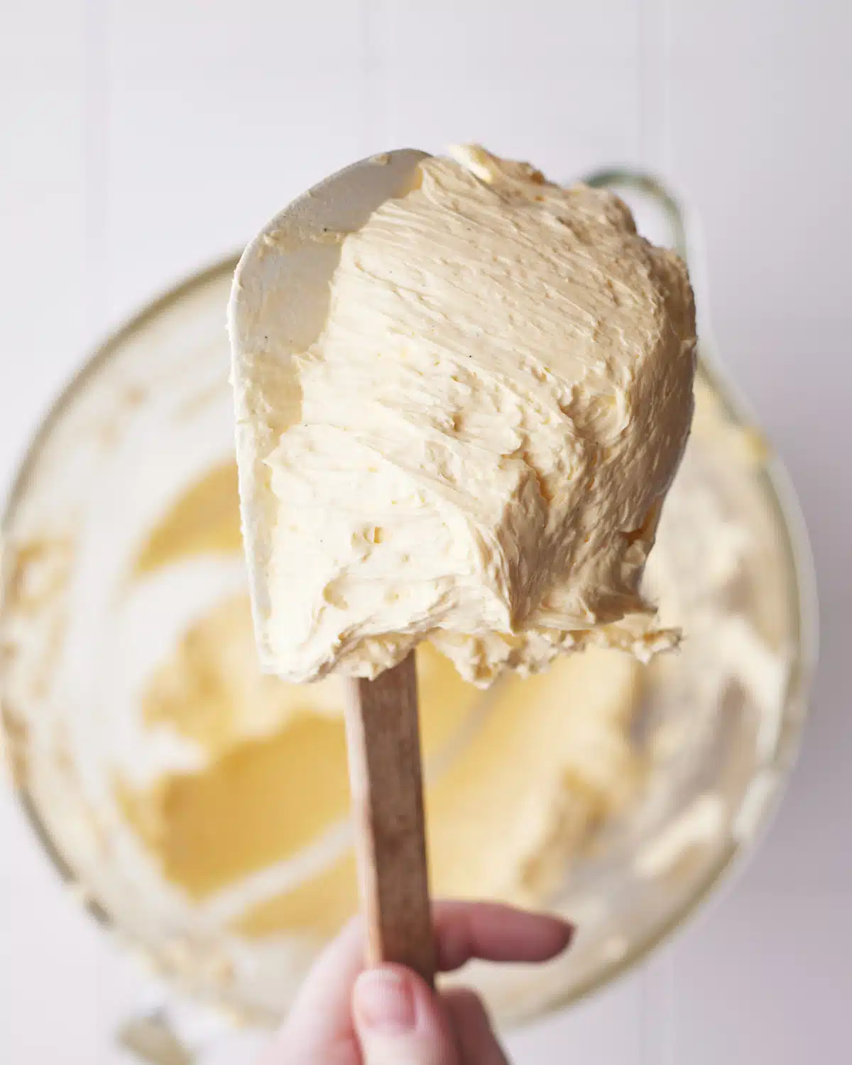 French Buttercream on a silicone spatula, thick and glossy.