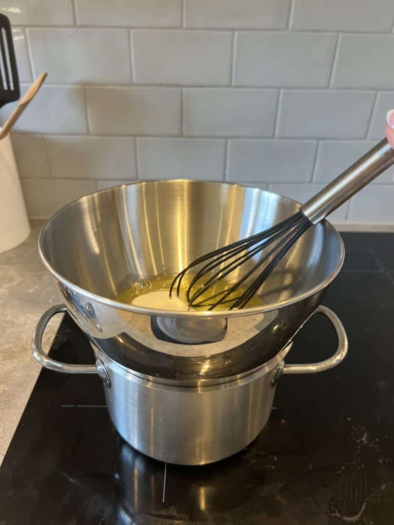 Double boiler to make marshmallow frosting for s'mores brownies.