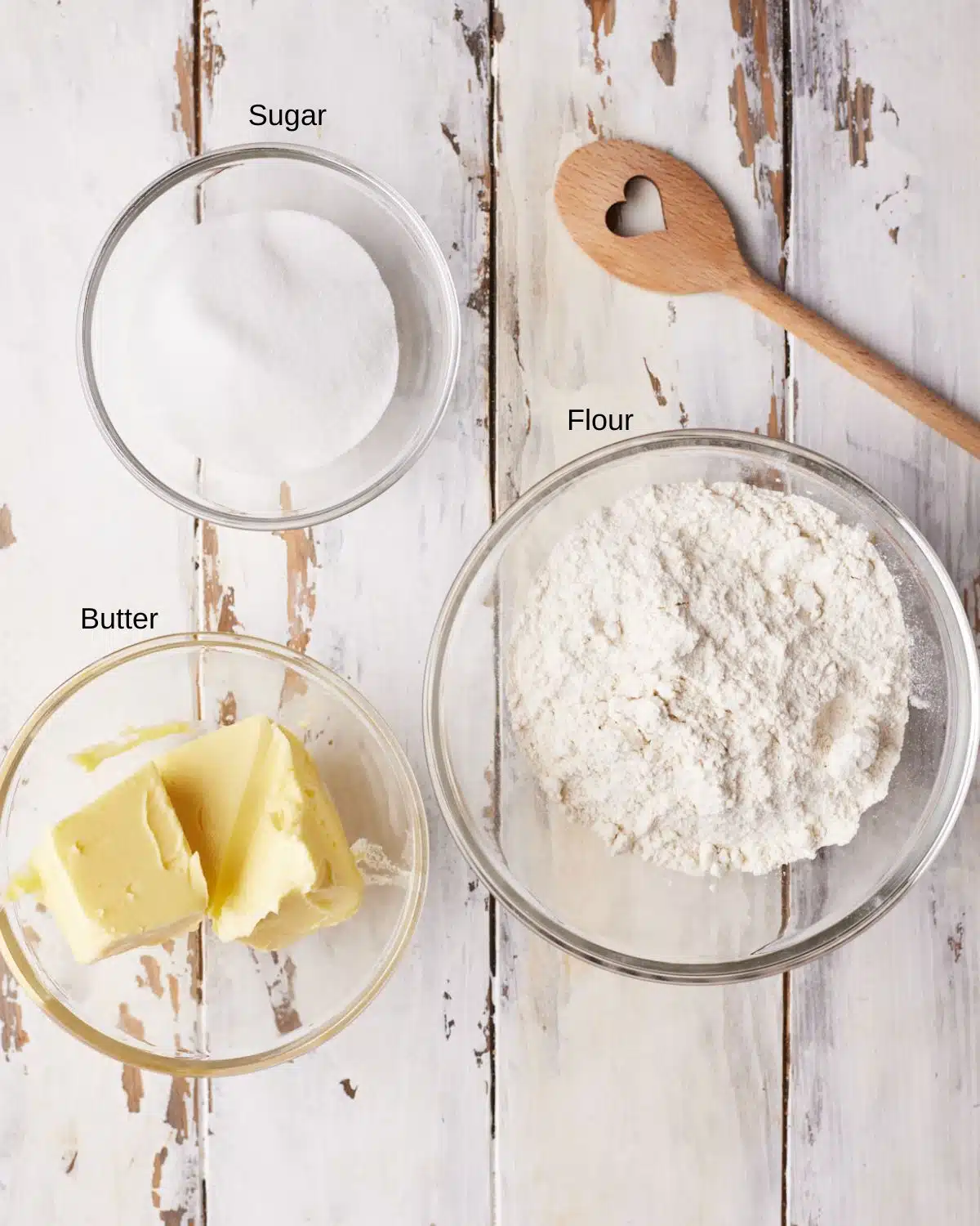 Ingredients to make traditional scottish shortbread - sugar, butter and flour.