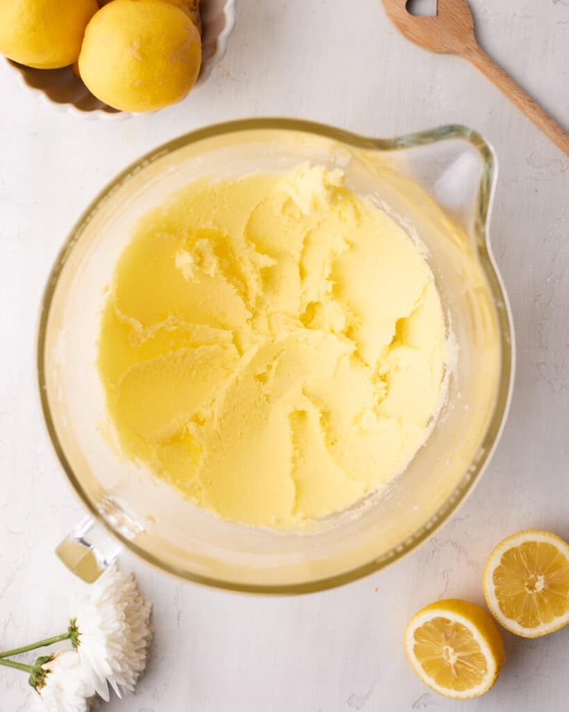 Butter and sugar creamed together to make lemon drizzle cake.